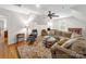 Inviting living room featuring hardwood floors, accent rug and a comfortable seating arrangement near natural light at 3133 English Sparrow Ln, Charlotte, NC 28210