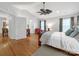 Large main bedroom with ceiling fan, plenty of natural light, and ensuite bathroom at 3133 English Sparrow Ln, Charlotte, NC 28210