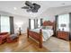 Main bedroom suite featuring a tray ceiling, hardwood floors, and ample natural light at 3133 English Sparrow Ln, Charlotte, NC 28210