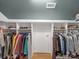 Spacious walk-in closet with built-in shelving and storage for shoes and folded clothes, rods for hanging garments at 3133 English Sparrow Ln, Charlotte, NC 28210