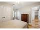 Standard bedroom with wood floors, closet, and window for natural light at 3223 Rheinwood Ct, Matthews, NC 28105