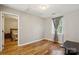 Wood floored bedroom with lots of light, large window, with a connected bedroom at 3223 Rheinwood Ct, Matthews, NC 28105
