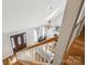 Lofted view of the foyer, living room with fireplace, and wooden stairway at 3223 Rheinwood Ct, Matthews, NC 28105