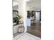 Inviting entryway with a mirrored console table, plush velvet stool, and view into an open kitchen at 397 Luray Way, Rock Hill, SC 29730