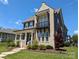 An eye-level exterior view reveals a charming two-story home with a welcoming front porch at 397 Luray Way, Rock Hill, SC 29730