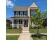 Charming two-story home with brick accents, a cozy front porch, and beautiful landscaping at 397 Luray Way, Rock Hill, SC 29730