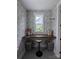 Cozy office nook featuring a built-in desk, natural light, and charming wallpaper at 397 Luray Way, Rock Hill, SC 29730