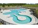 Aerial view of community pool with lounge areas, zero entry access, and lush landscaping at 397 Luray Way, Rock Hill, SC 29730