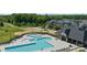 Aerial view of community pool, clubhouse, and surrounding neighborhood with lush green landscaping at 397 Luray Way, Rock Hill, SC 29730