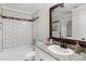Bathroom showcasing granite vanity, subway tile, and a bathtub at 4072 Town Center Rd, Harrisburg, NC 28075