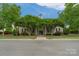 Charming clubhouse with manicured landscaping and inviting entrance, perfect for community gatherings at 4072 Town Center Rd, Harrisburg, NC 28075