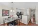 Dining room and kitchen area with granite countertops and modern appliances at 4072 Town Center Rd, Harrisburg, NC 28075
