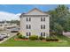 Exterior view of the building showcasing its well-maintained landscaping and ample parking at 4072 Town Center Rd, Harrisburg, NC 28075