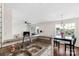Inviting living space with open kitchen, dining, and living areas, plus balcony access at 4072 Town Center Rd, Harrisburg, NC 28075