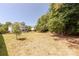 Large backyard featuring a brick patio and comfortable seating, perfect for relaxation and outdoor activities at 4117 Wallbrook Dr, Matthews, NC 28105