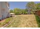Spacious backyard features a brick patio and a large lawn, perfect for outdoor activities at 4117 Wallbrook Dr, Matthews, NC 28105