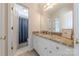 Bathroom vanity featuring granite countertops, white cabinetry, and access to a toilet and shower room at 4117 Wallbrook Dr, Matthews, NC 28105