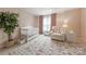 Charming Bedroom with a decorative rug, plush chair, crib, and soft color palette at 4117 Wallbrook Dr, Matthews, NC 28105