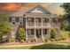 Stunning brick home with a double porch, columns, and beautifully landscaped front yard at 4117 Wallbrook Dr, Matthews, NC 28105