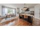 Eat-in kitchen with a view of the backyard and bright white cabinetry at 4117 Wallbrook Dr, Matthews, NC 28105