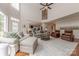 Open living room with vaulted ceilings, large windows, and a view of the kitchen at 4117 Wallbrook Dr, Matthews, NC 28105