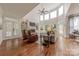 Bright living room with fireplace, built-in shelving, and large windows that let in lots of natural light at 4117 Wallbrook Dr, Matthews, NC 28105