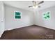 Bedroom with ceiling fan, plush carpets and two windows at 412 Brook St, Salisbury, NC 28146