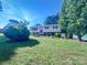 Charming split-level home featuring mature landscaping and a well-maintained front lawn at 412 Brook St, Salisbury, NC 28146