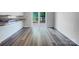 Bright living room with sliding glass doors and hardwood style floors offers a modern aesthetic at 412 Brook St, Salisbury, NC 28146