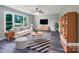 Bright, staged living room with large window, ceiling fan, modern furniture, and stylish decor at 412 Brook St, Salisbury, NC 28146
