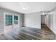 An expansive living room featuring hardwood-style floors and a walkout to a deck area at 412 Brook St, Salisbury, NC 28146