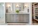 Bathroom features a gray double sink vanity, marble countertops, and a walk-in shower at 421 Mcdonald Ave, Charlotte, NC 28203