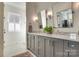 Bright bathroom with a double sink vanity, elegant fixtures, and tile flooring at 421 Mcdonald Ave, Charlotte, NC 28203
