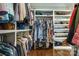 Organized walk-in closet with custom shelving for shoes and hanging space for clothes at 421 Mcdonald Ave, Charlotte, NC 28203