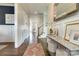Elegant entryway with hardwood floors, stylish console table, and staircase at 421 Mcdonald Ave, Charlotte, NC 28203