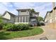 Charming home with a well manicured yard, screened in porch, paver driveway, and neutral exterior paint at 421 Mcdonald Ave, Charlotte, NC 28203