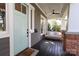 Inviting front porch featuring a porch swing, ceiling fan, and stylish accents at 421 Mcdonald Ave, Charlotte, NC 28203