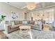 Inviting living room featuring a comfortable sectional sofa and an open layout to the modern kitchen at 421 Mcdonald Ave, Charlotte, NC 28203