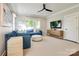 Comfortable living room with plush seating, a ceiling fan, and large windows at 421 Mcdonald Ave, Charlotte, NC 28203