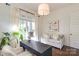 Well-lit home office with a sofa, modern desk and chair, creating a cozy workspace at 421 Mcdonald Ave, Charlotte, NC 28203