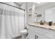 Bathroom with granite countertop, updated sink fixtures, and shower curtain at 4949 Southview Dr, Hickory, NC 28602