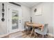 Cozy breakfast nook with wood table, comfortable seating, and a door to outdoor space at 4949 Southview Dr, Hickory, NC 28602