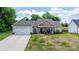 Inviting one-story home with a well-manicured lawn, covered porch, and an attached two-car garage at 4949 Southview Dr, Hickory, NC 28602