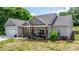 Charming single-story home with stone accents, covered porch, and attached two-car garage at 4949 Southview Dr, Hickory, NC 28602