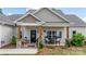 Welcoming front porch with decorative wreath and cozy seating arrangement at 4949 Southview Dr, Hickory, NC 28602