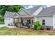 Inviting covered porch with stone pillars and charming decor at 4949 Southview Dr, Hickory, NC 28602
