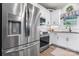 Bright kitchen features stainless steel appliances, granite counters, and white cabinetry at 4949 Southview Dr, Hickory, NC 28602