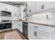 Well-equipped kitchen with white cabinets, granite countertops, and stainless steel appliances, perfect for cooking and entertaining at 4949 Southview Dr, Hickory, NC 28602