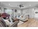 Spacious living room with stylish furniture, a grand piano, and plenty of natural light, perfect for relaxation and entertainment at 4949 Southview Dr, Hickory, NC 28602