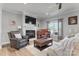 Inviting living room featuring a fireplace, piano, and plush seating, creating a warm and comfortable atmosphere at 4949 Southview Dr, Hickory, NC 28602